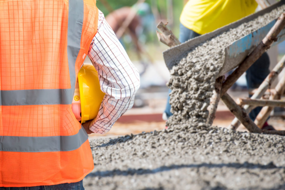 Civil Engineering check a Concrete pouring during commercial con